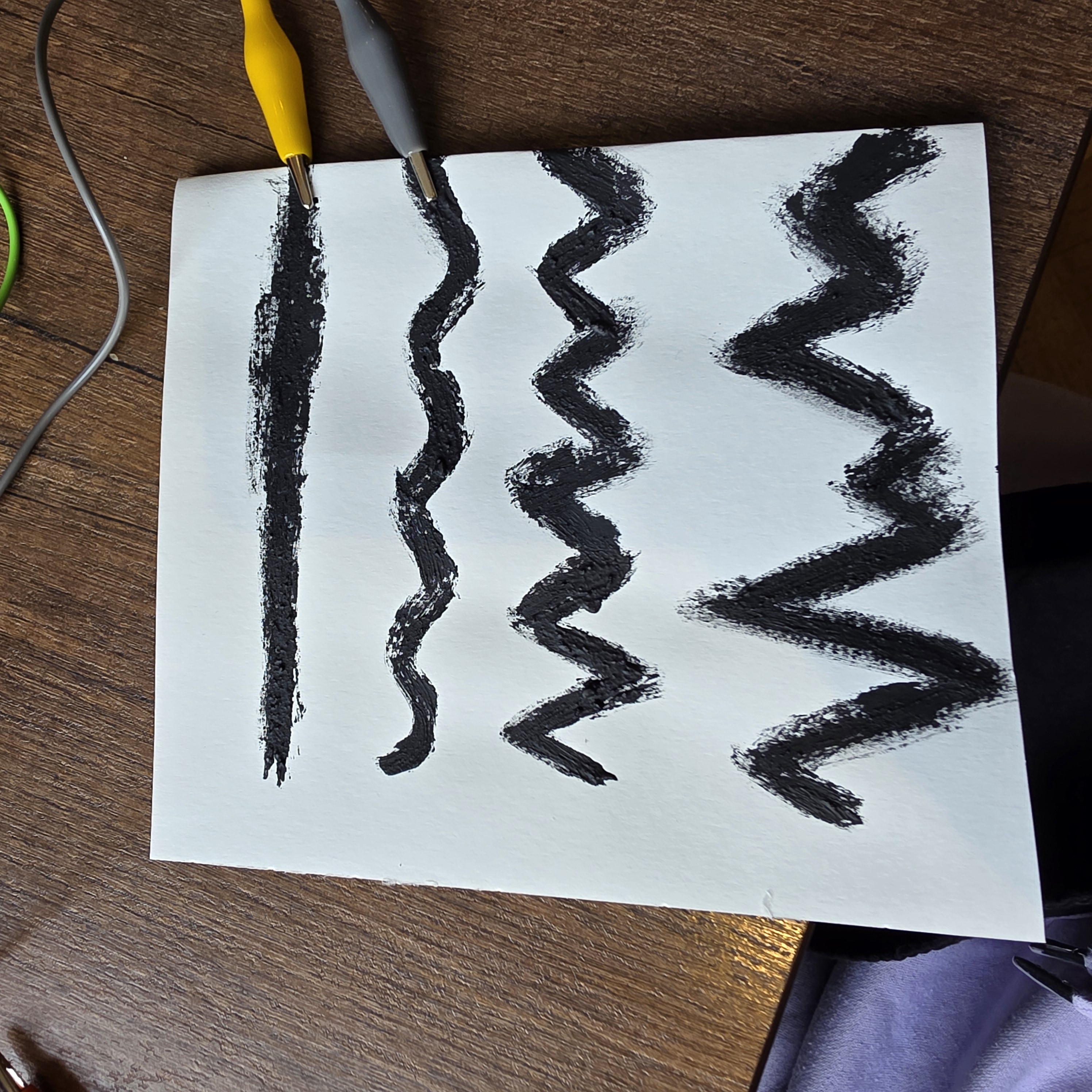 using conductive paint again to make different types of line to convey on the code such as a straight line, a zig zag line, and a wavy line