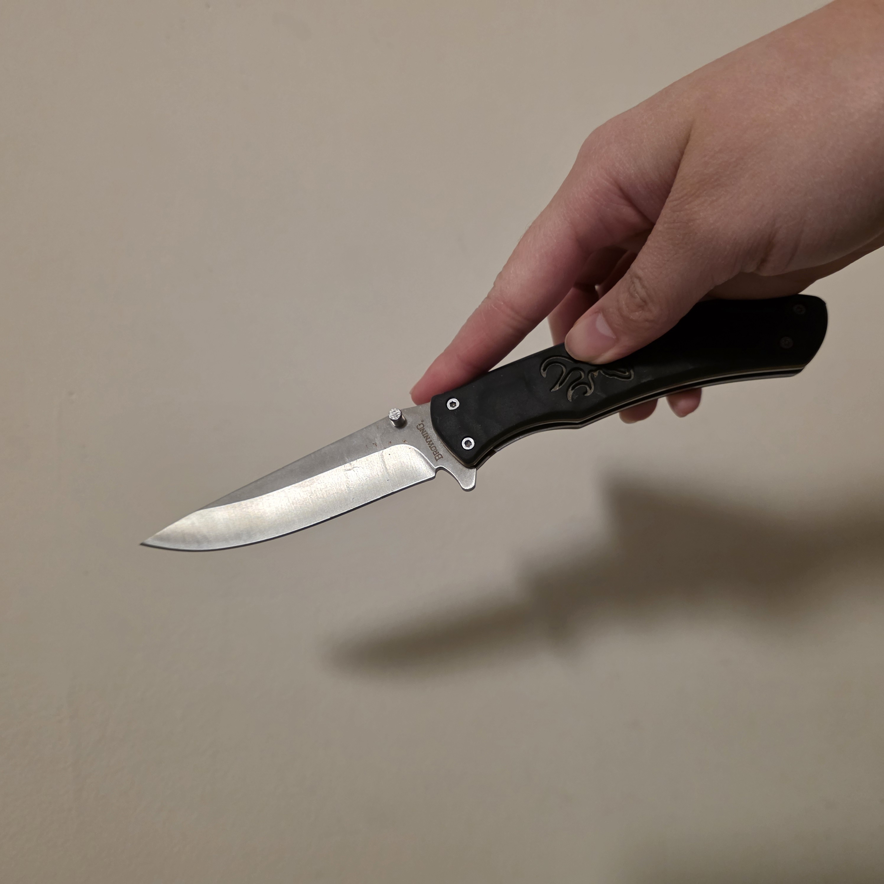 A butterfly knife is an object-based interaction because it uses the weight of its handles to swing the blade into place.